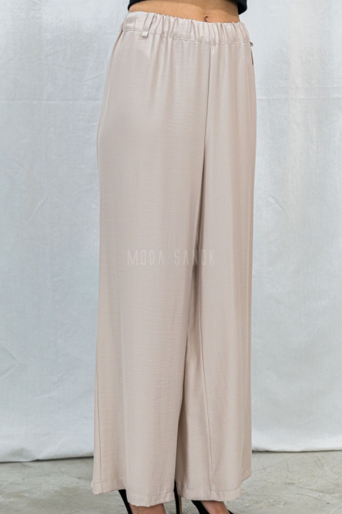 Letnie spodnie damskie z szeroką nogawką, lużne cienkie w kolorze beżowym CORALLINE -  MODA SANOK