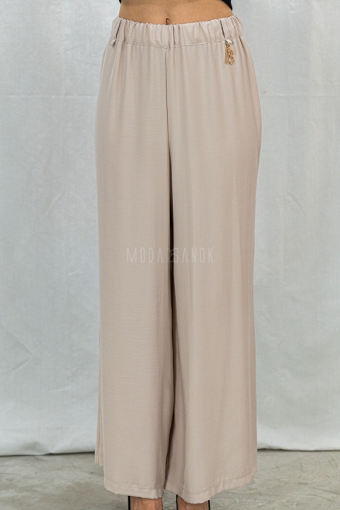 Letnie spodnie damskie z szeroką nogawką, lużne cienkie w kolorze beżowym CORALLINE -  MODA SANOK